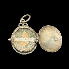 Sterling silver breast locker medallion-reliquary with engraving of the ...